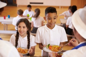 Children being served lunch at school