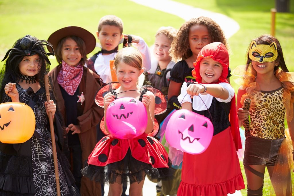Children dressed in Halloween costumes trick or treating