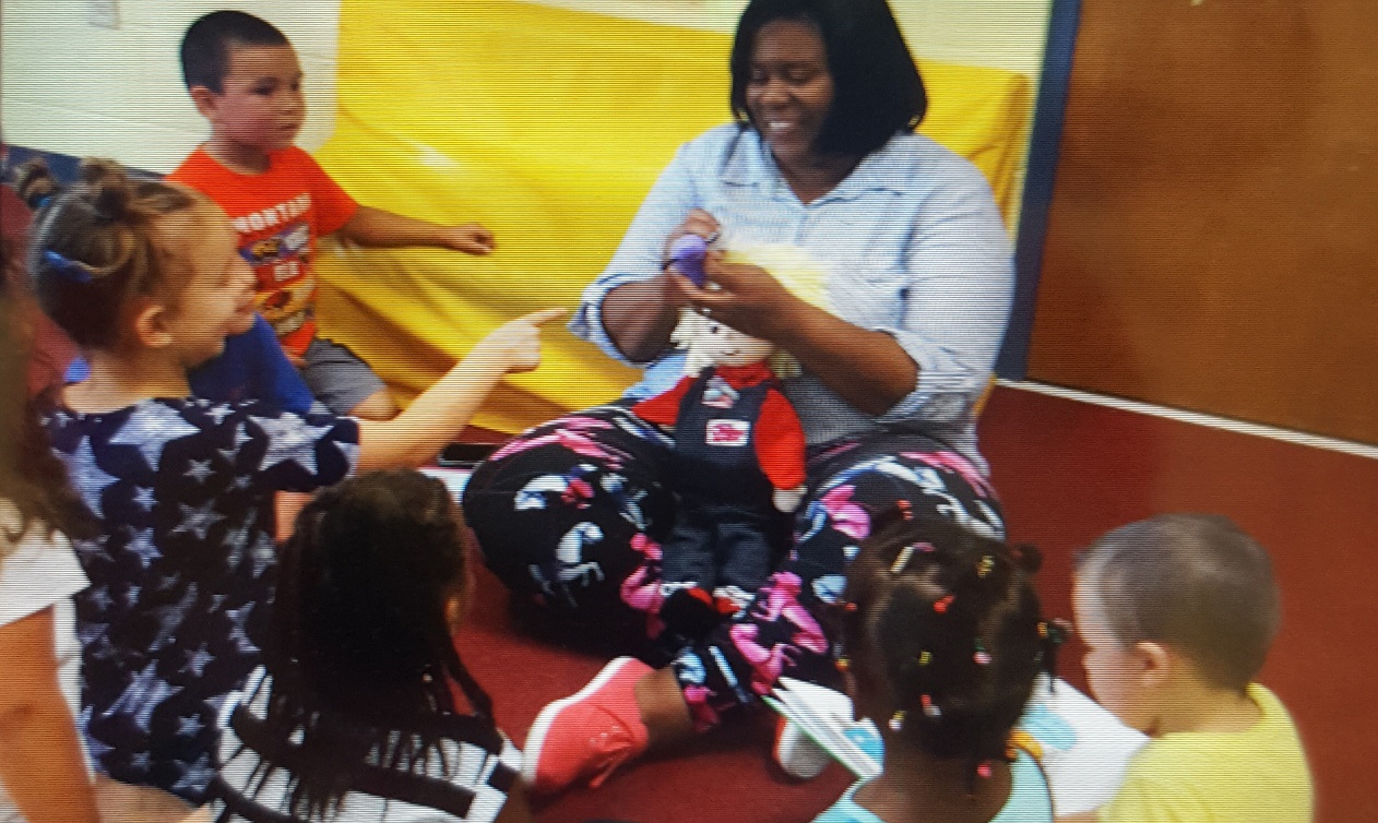 A teacher shows the Organ Wise Guy to children at the IU Health West center
