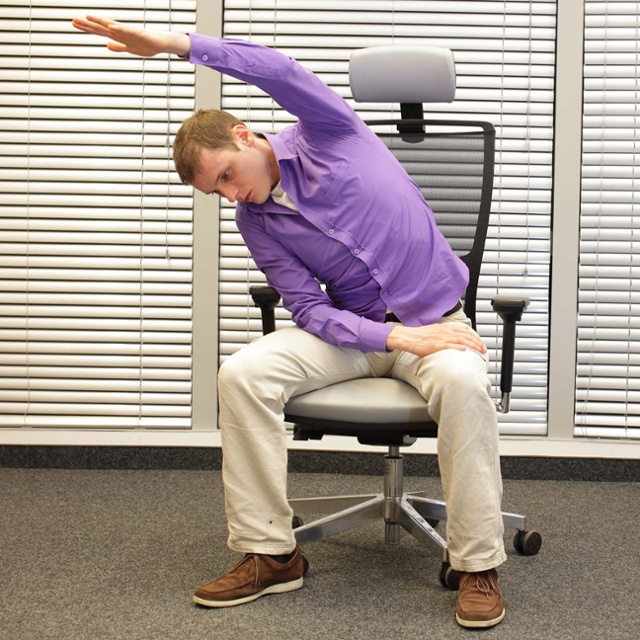 Employee stretching in his chair