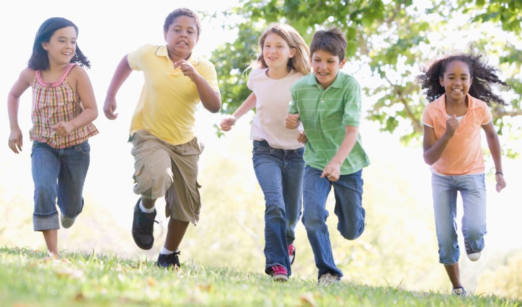 Group of kid running outside