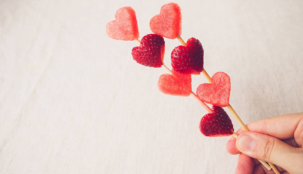 Skewers with heart shaped fruit pieces