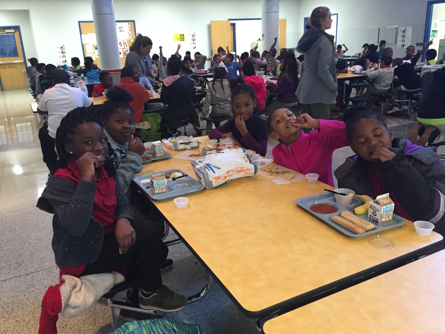Kids sampling radishes at school