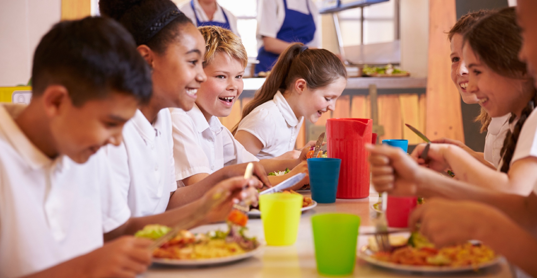 Children eating lunch at a school table