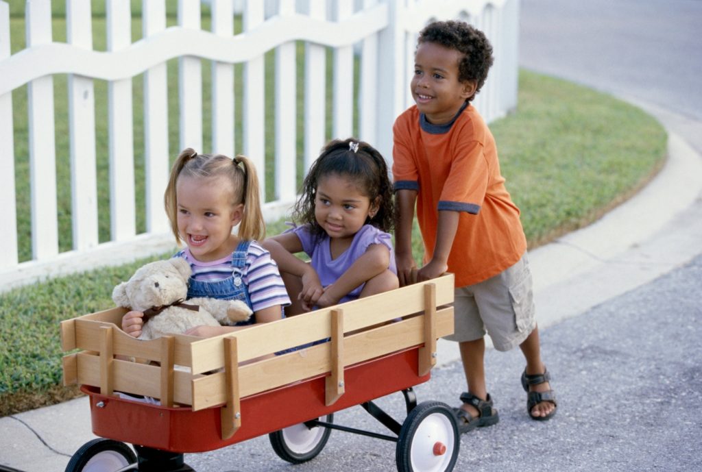Kids playing in a wagon