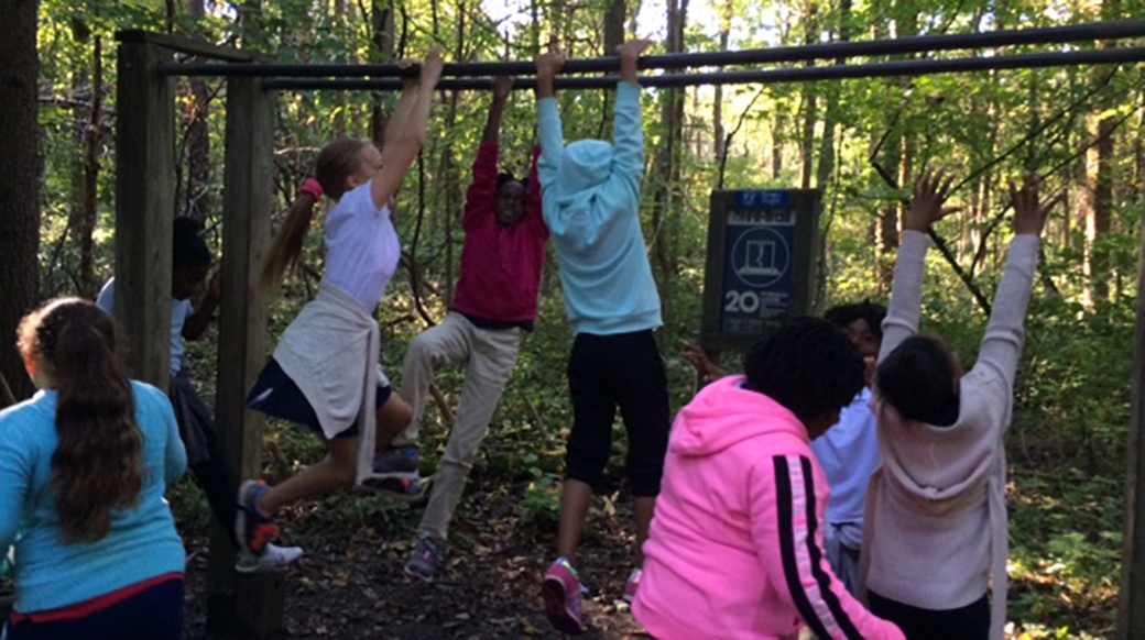 Students from Pike play on the bars