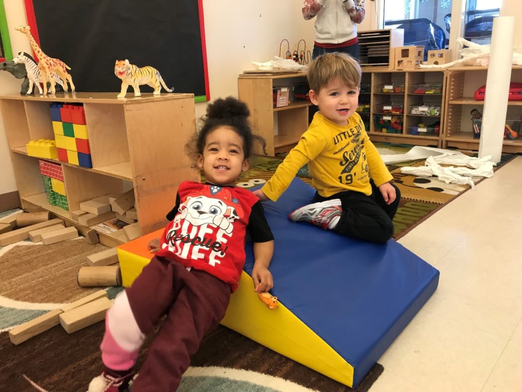 Young children play in a high quality child care center