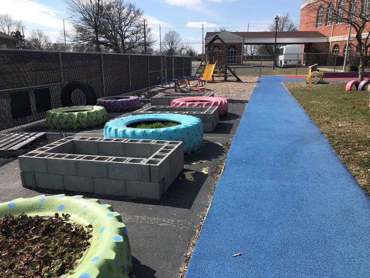 Promiseland child care has a large garden area with planters made from tires