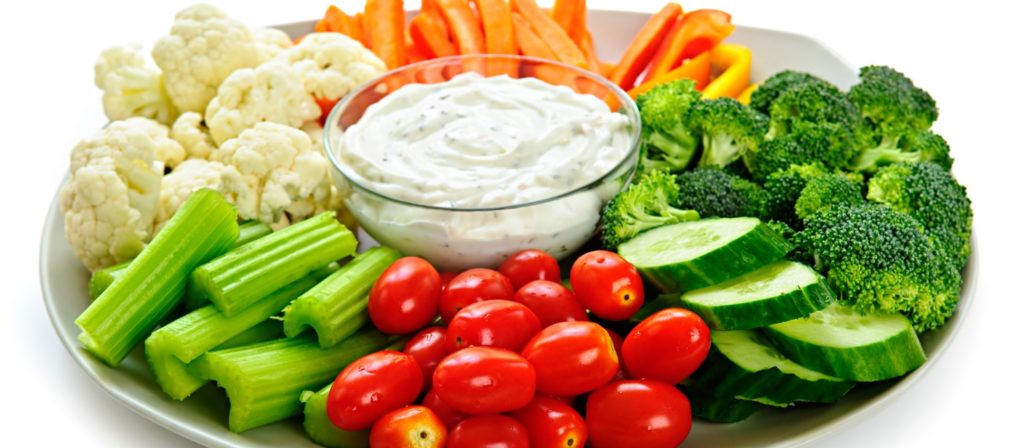 A veggie tray with dip