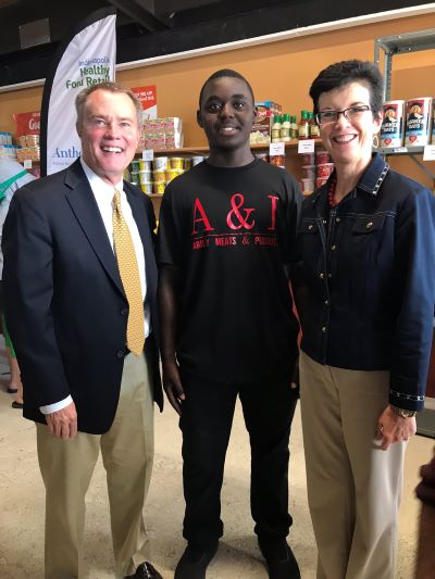 Mayor Hogsett smiles with an A & I employee and Jump IN CEO Julie Burns