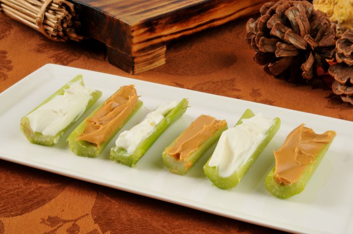 Celery sticks with peanut butter and cream cheese