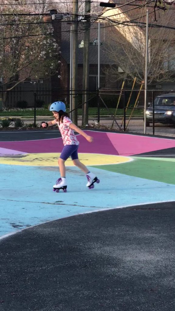 Blog author's daughter roller skating outside
