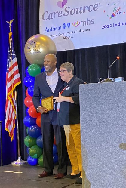 Dr. Young receives the Governor and Cheri Daniels award for work on healthy schools at the 2022 School Health Network Conference